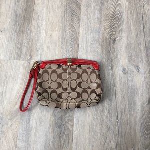 Coach large wristlet with red trim